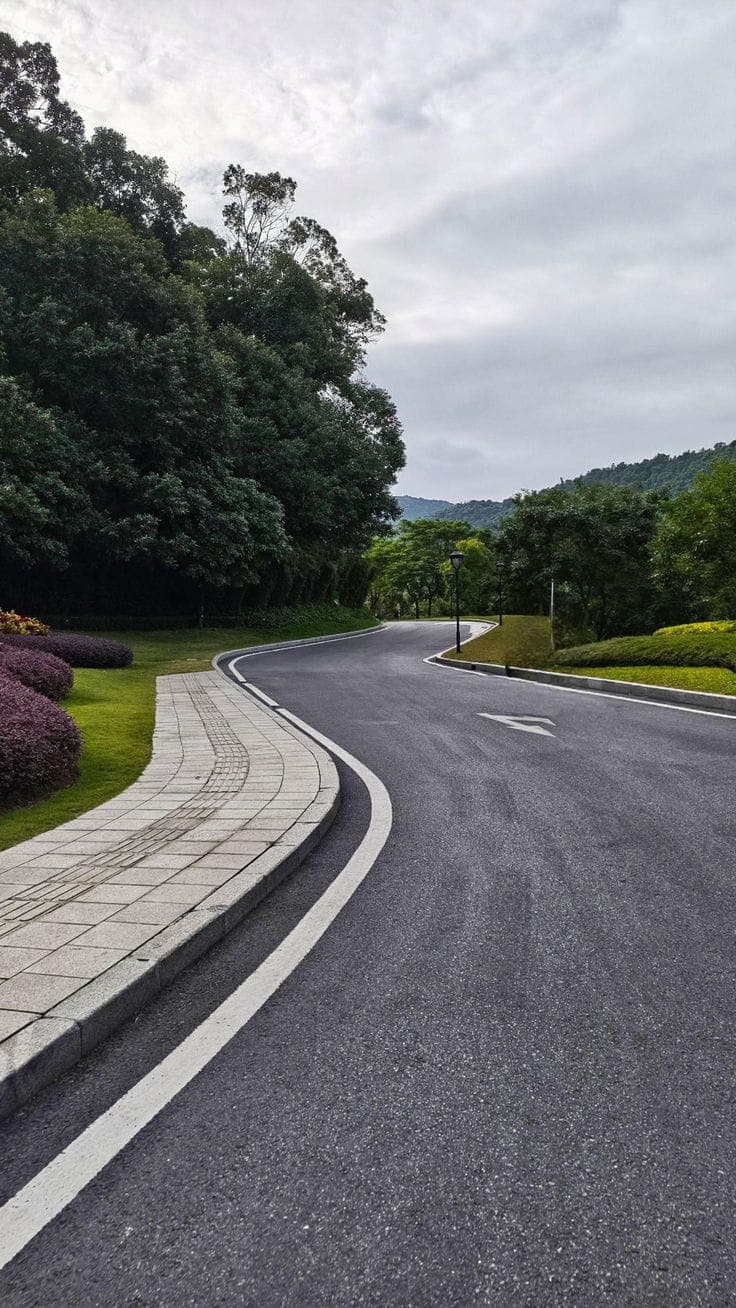 Winding road with concrete kerb edging — UCB Road & Drainage Infrastructure in Kenya by Unique Concrete Builders