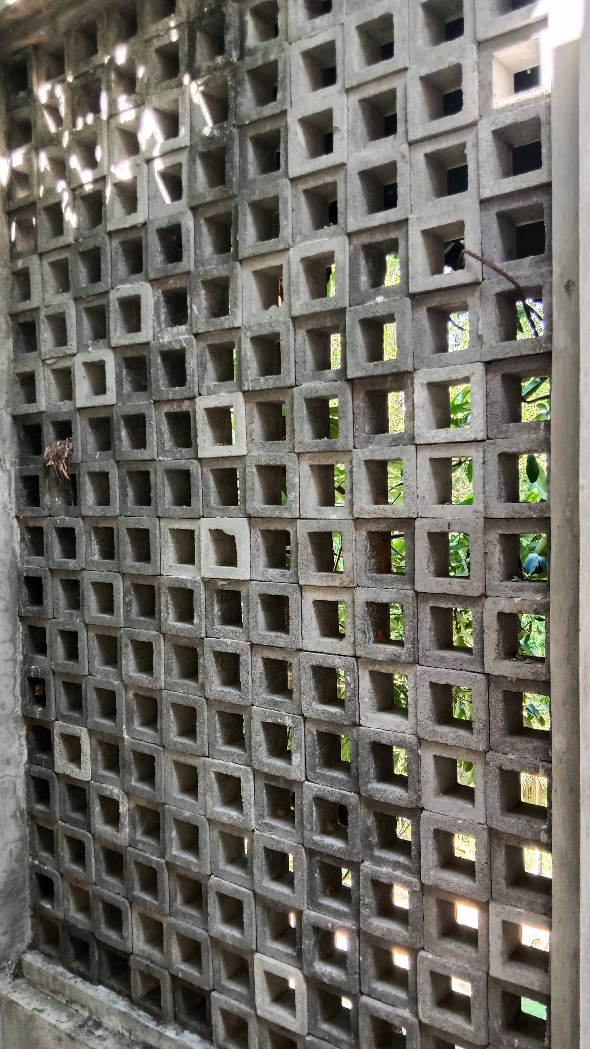 Unique Concrete Builders Eliza Grills — Eliza-pattern clay ventilation grills in a building